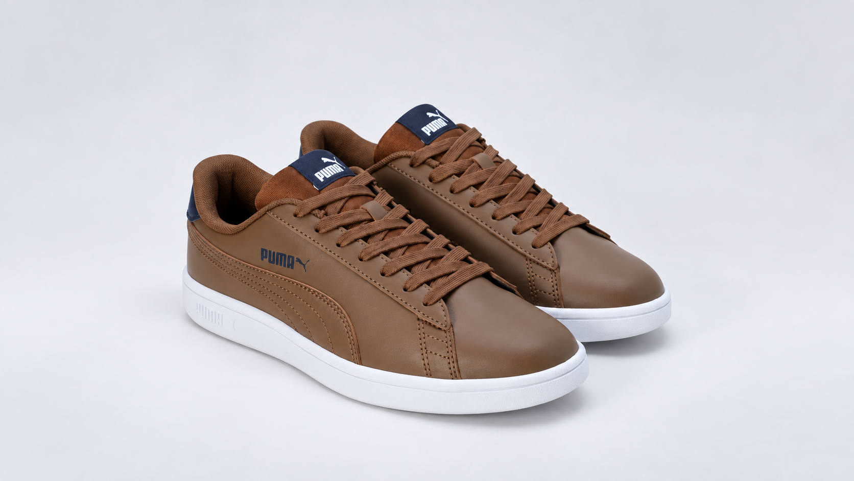 PUMA Smashic Comfort Casual Sneakers in brown and navy three-quarter view