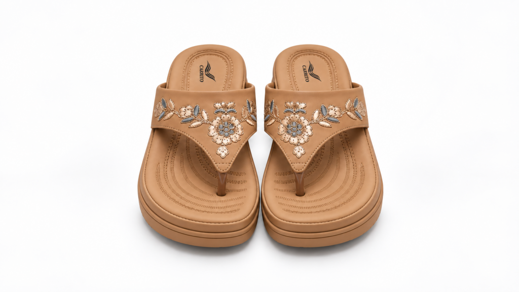 Front view of tan Carrito floral wedge sandals with toe-post design